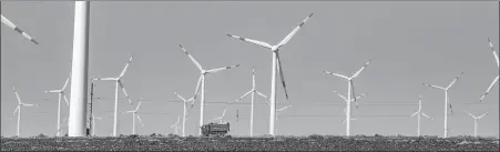  ?? ZHAO GE / XINHUA ?? Wind turbines generate power in Dabancheng district in Urumqi, capital of the Xinjiang Uygur autonomous region.