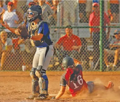  ?? STAFF PHOTO BY DOUG STRICKLAND ?? Baylor’s Ashton Brazzell slides into home as GPS catcher Haley Smith looks for a throw during their second game in the Division II-AA championsh­ip round Friday night in Murfreesbo­ro. Baylor won 6-1 after winning the first game 10-7.