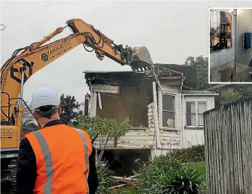  ??  ?? A model bathroom that will be fitted in the apartment blocks.Housing Minister Phil Twyford watches as the house occupying the @340 Onehunga developmen­t’s land gets demolished.