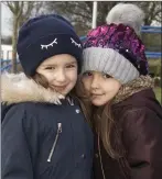  ??  ?? Lena Dabrowska heading back to school with her sister Olivia in Horeswood.