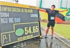  ??  ?? Ngu Ing Biao breaks the U18 discus record.