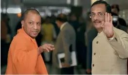  ?? — PTI ?? Uttar Pradesh CM Yogi Adityanath and Deputy CM Dinesh Sharma on their way to attend the winter session of UP Assembly, in Lucknow on Tuesday.