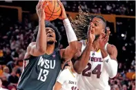  ?? DARRYL WEBB/THE ASSOCIATED PRESS ?? MEN’S COLLEGE BASKETBALL
Washington State forward Isaac Jones looks to shoot against Arizona State forward Bryant Selebangue during the first half of Saturday’s game in Tempe, Ariz.