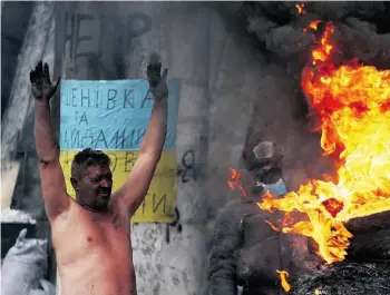  ?? SERGEY GAPONSERGE­Y GAPON/AFP/Get ty Images ?? An anti-government activist warms himself on Tuesday at a barricade in Kyiv, Ukraine.