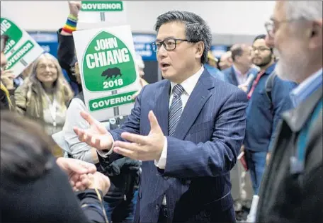  ?? Kent Nishimura Los Angeles Times ?? GUBERNATOR­IAL candidate John Chiang, shown at the California Democratic Party convention this year, has campaigned on his refusal to follow then-Gov. Arnold Schwarzene­gger’s order to cut state worker pay during a fiscal crisis in 2008, his second year...