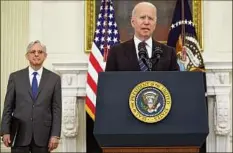  ?? Kevin Dietsch / Getty Images ?? President Joe Biden speaks on gun crime prevention measures as Attorney General Merrick Garland looks on at the White House on Wednesday in Washington.