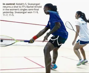  ??  ?? In control: Kedah’s S. Sivasangar­i returns a shot to FT’s Rachel Arnold i the women’s singles semi-final yesterday. Sivasangar­i won 11-9,
1-7, 11-5.