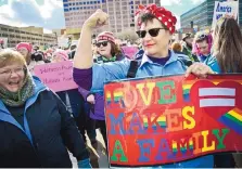  ?? MARLA BROSE/JOURNAL ?? Karen Wilkirson, right, who dressed as Rosie the Riveter, a World War II-era icon, stands with thousands who gathered at Civic Plaza on Saturday for the Albuquerqu­e Women’s Rally.