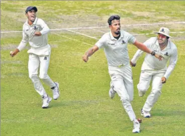  ?? PTI ?? Bengal pace bowler Ishan Porel celebrates with teammates after dismissing Karnataka opener KL Rahul for nought.