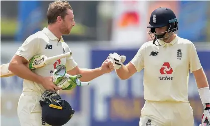  ??  ?? Jos Buttler (left) made 55 and was in the perfect position to watch Joe Root’s 186 in the second Test against Sri Lanka at Galle. Photograph: Sri Lanka Cricket