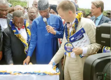  ??  ?? The Minister of State for Education, Professor Anthony Gozie Anwukah (in Blue) performing the Ground-Breaking ceremony; with him is from left the Minister of Health, Professor Isaac Adewole and the German Ambassador, Mr. Bernard Schlagheck