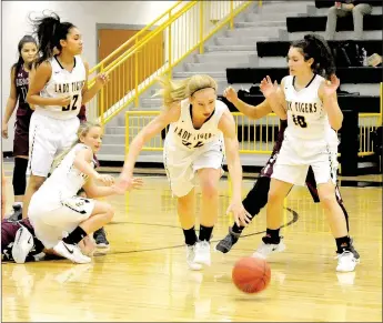  ?? MARK HUMPHREY ENTERPRISE-LEADER ?? Prairie Grove senior Sarah James-Stone comes out of a scramble for a loose ball with the dribble gaining possession for the Lady Tigers. Prairie Grove needed overtime to beat Lincoln, 58-50, Friday.