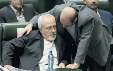  ?? Ebrahim Noroozi/the Associated Press ?? Mohammad Javad Zarif, Iranian foreign minister, left, said sanctions can’t force Tehran to change its nuclear policy.