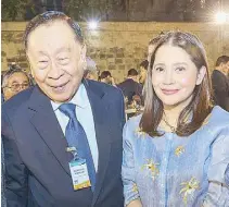  ?? ?? Former executive secretary Alberto Romulo shares a laugh with daughter BSP Deputy Governor Bernadette Romulo-Puyat.