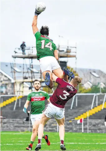  ?? PHOTO: RAMSEY CARDY/SPORTSFILE ?? Close contact: Aidan O’Shea of Mayo climbs above Galway’s Seán Andy Ó Ceallaigh during last Sunday’s Allianz Football League Division 1 match at Tuam Stadium, Galway.