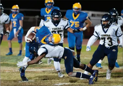  ?? SERGIO BASTIDAS PHOTO ?? Brawley Union High’s Nathan Godinez gets sacked as he runs the ball against Morse High during a CIF San Diego Div. III football game on Friday in Brawley.