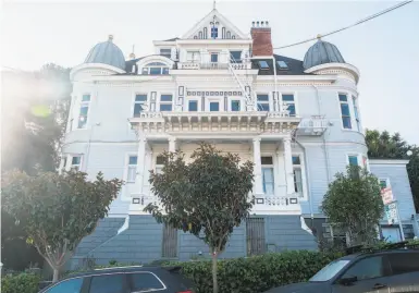  ?? Photos by Nick Otto / Special to The Chronicle ?? The 45room Nobby Clarke Mansion, a city landmark, towers over its neighbors in Eureka Valley.