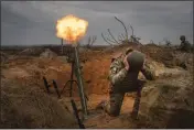  ?? EFREM LUKATSKY — THE ASSOCIATED PRESS ?? Soldiers of Ukraine's National Guard 1st brigade Bureviy (Hurricane) practice at a military training ground in the north of Ukraine on Wednesday.