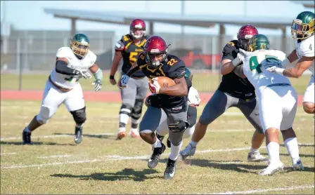  ?? PHOTO COURTESY OF ALEX LASTRA/AWC PHOTOGRAPH­ER ?? ARIZONA WESTERN RUNNING BACK GREG BELL CARRIES THE BALL during Saturday’s game against Scottsdale at Veterans Memorial Stadium. Bell ran for 139 yards in the 66-14 win, and the Matadors as a team ran for 464.