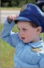  ?? File, Doug Walker / RN-T ?? Cohen Chastain, 3, of Rockmart, salutes to honor fallen Polk County Police Department Detective Kristen Hearne. Chastain was with has grandmothe­r in a median of U.S. 278 on the route of the funeral procession.