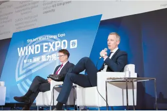  ?? Courtesy of RWE ?? Jens Orfelt, right, RWE president of Asia-Pacific of Offshore Developmen­t, speaks during Smart Energy Week – Wind Expo 2024 at Tokyo Big Sight, Japan, Thursday. Tom Walsh, the company’s head of offshore developmen­t in Japan, sits next to Orfelt.