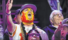  ?? Matt York The Associated Press ?? A Kansas City Chiefs fan cheers during the NFL football Super Bowl LVII opening night on Monday at Footprint Center in Phoenix.