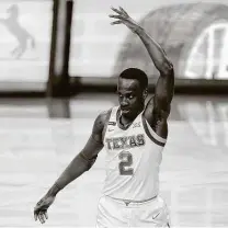  ?? Eric Gay / Associated Press ?? Texas’ Matt Coleman, who did a bit of everything with 11 points, nine rebounds and five assists, celebrates in the second half.