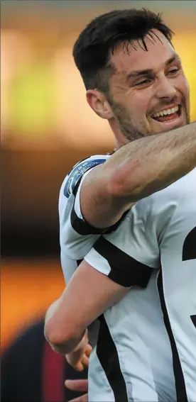  ??  ?? Patrick Hoban is congratula­ted by Dean Jarvis after scoring Dundalk’s fourth goal against Bray Wanderers at Oriel Park on Friday evening.