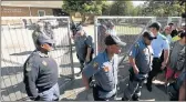  ??  ?? ON GUARD: Police from Port Elizabeth stand in front of the closed Alexandria High School