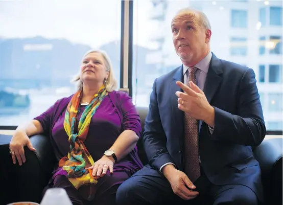  ?? — CP FILES ?? Premier John Horgan says he faced opposition within his own family over his controvers­ial decision to go ahead with the Site C dam with his wife Ellie, left, opposed to the project as well as his ailing brother Pat, who has terminal cancer.