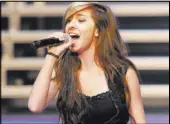  ?? ROBB D. COHEN/INVISION/AP FILE ?? “The Voice” Season 6 contestant Christina Grimmie performs as part of “The Voice Tour” June 29, 2014, at Cobb Energy Centre in Atlanta. Grimmie was fatally shot after a performanc­e Friday in Orlando, Fla.