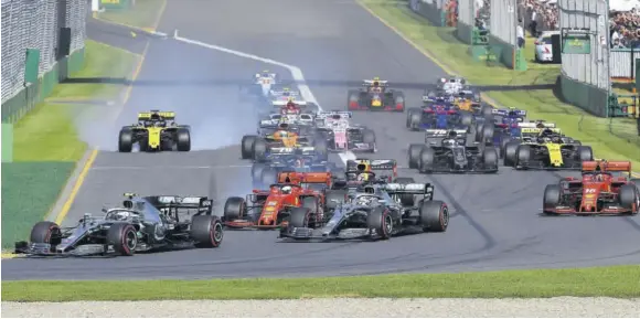  ?? (Photos: AFP) ?? This file photo taken on March 17, 2019 shows Mercedes’ Finnish driver Valtteri Bottas (left) leading the pack at the start of the Australian Grand Prix in Melbourne. Formula One’s Australian and Chinese Grand Prix events were postponed yesterday as the COVID-19 coronaviru­s caused disruption for a second-straight season.