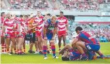  ?? Picture: GETTY IMAGES ?? Tautau Moga is tended to on the field.