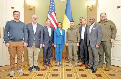  ?? Reuters ?? Ukraine’s President Volodymyr Zelensky and US House Speaker Nancy Pelosi (D-CA) pose with their delegation­s before a meeting in Kyiv on Saturday.