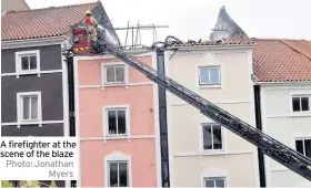  ?? Photo: Jonathan Myers ?? A firefighte­r at the scene of the blaze