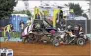  ?? SUBMITTED PHOTO - CARL HESS ?? This tangle in the Wingless 600Sprints­í ìMad Scrambleî sent the 4th turn flagman scrambling. Thatís Johnny Smith in the #4s and Kyle Lick (8) getting the worst of the collision.