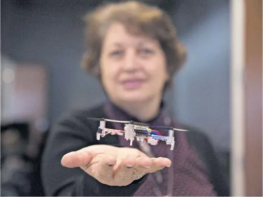  ??  ?? HANDY: Naira Hovakimyan of the University of Illinois with a drone she hopes could one day carry out household tasks, like retrieving a medicine bottle.