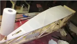  ?? ?? Start covering the fuselage with the bottom surface.