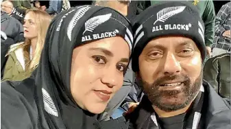  ??  ?? Rehana Ali wears her All Blacks hijab while at the recent test match with her husband Azam Ali.