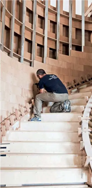  ??  ?? A Yachtline 1618 craftsman works on a commission­ed
staircase.