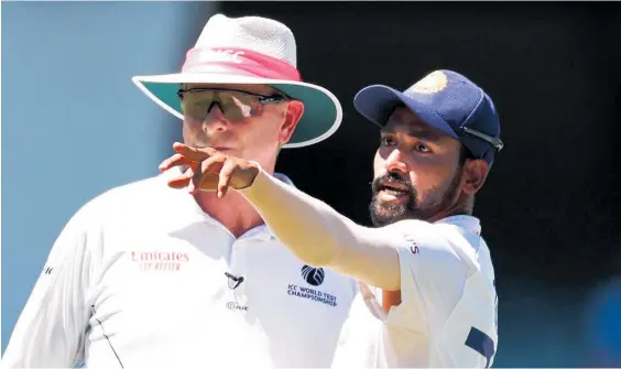  ?? Photo / Getty Images ?? Mohammed Siraj made a formal complaint to umpire Paul Reiffel about some spectators in the bay behind his fielding position.