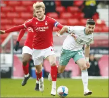  ??  ?? TANGLE: Forest’s Joe Worrall, left, and Cherries’ Shane Long