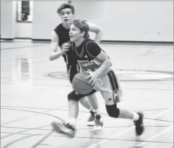  ??  ?? Horton Griffins #1 Aidan Clarke looks for the hoop in the championsh­ip game of the Horton High New Year’s Classic.