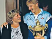  ??  ?? Boris Becker and his mother Elvira following his victory at Wimbledon in 1986. The trophy has been found in the care of his mother