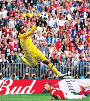  ?? — GETTY IMAGES ?? Saudi Arabia goalkeeper Abdullah Al-Mayouf makes a spectacula­r save during the World Cup opener. Unfortunat­ely, the Russians were still able to get five goals past him.