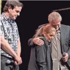  ?? FOR THE COMMERCIAL APPEA L ?? Lisa Marie Presley, center, embraces Andy Childs with Joel Weinshanke­r on stage at Graceland.