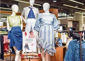  ?? — AFP ?? At Nordstrom in downtown Seattle, the mannequins on the left and middle are size 2 while the mannequin on the right is size 12.