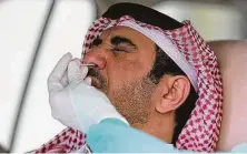  ?? Karim Jaafar / AFP via Getty Images ?? Qatar has the world's highest per capita infection rate but one of the lowest death rates — an outcome of expanded testing.