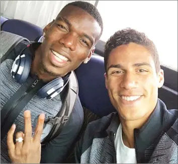  ??  ?? CALM BEFORE THE STORM . . . French stars Paul Pogba (left) and Raphael Varane pose for a photo on their way to St Petersburg where they will take on Belgium in the FIFA World Cup semi-finals tonight. Mailonline