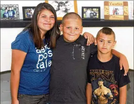  ?? GREG LYNCH / STAFF 2009 ?? Tyler Maloney, 11, (center) was on an obstacle course bounce ride eight years ago in a Middletown park when the inflatable unit pulled away from the ground and floated end over end with Maloney hanging on. With him at the park that day were his sister...